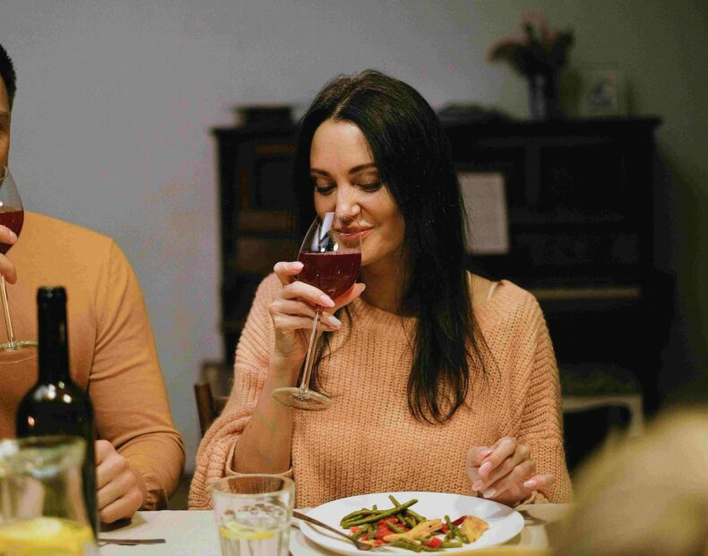 A girl with a glass of wine